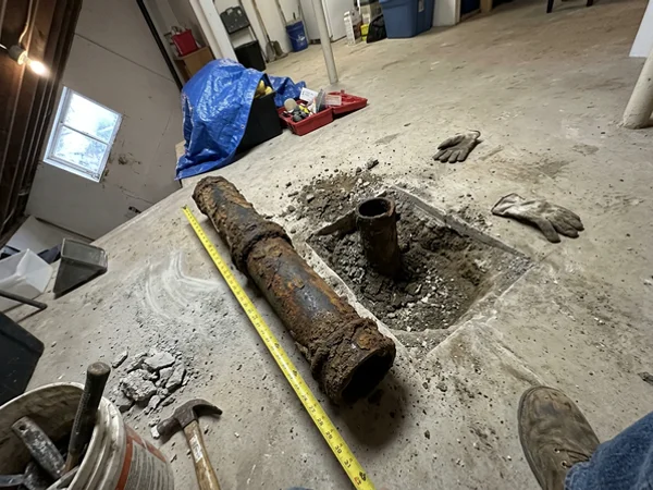 Damaged drain section removed and photographed for the adjuster