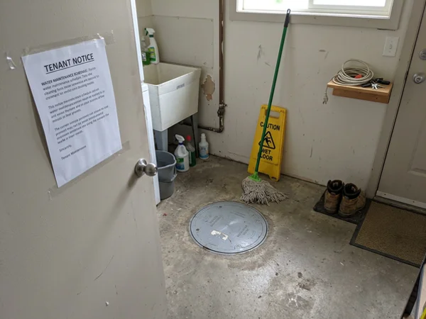 Finished mainline valve cover in a multi-unit utility room